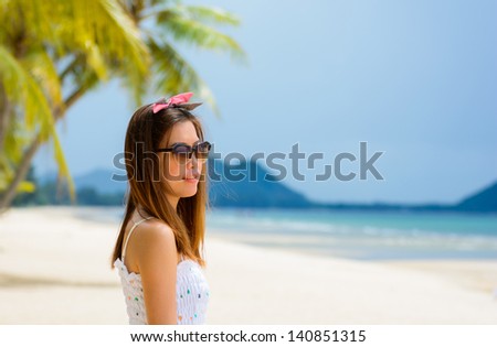 Beautiful woman smiling at the seaside