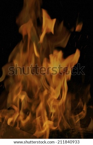 Fire Background - Beautiful Golden Colors through a Black Night