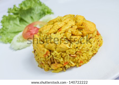 close up fried rice with yellow ginger with chicken, Thai food on white dish