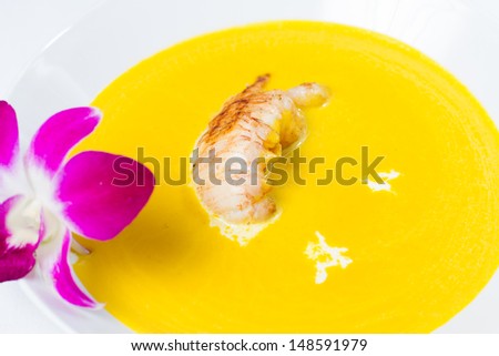 Cream of roasted pumpkin soup accented with grilled rock lobster