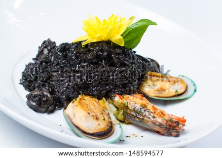 Black squid ink risotto rice with squid, mussel and prawns