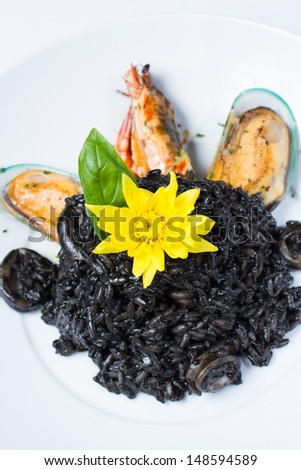 Black squid ink risotto rice with squid, mussel and prawns