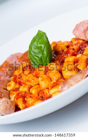 italian pasta gnocchi with fresh Italian pork sausage in spicy tomato sauce