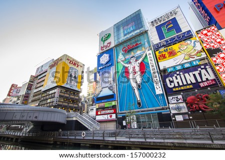 Osaka, Japan - December 1 : Japanese People Wander In Dotonbori Area Of Osaka After Work On December 1 2012. Dotonbori Is An Entertainment Area Of Osaka Famous For Its Neon Signs.