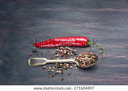 colored peppers mix, red chilly peppers  on a wooden table,  selective focus