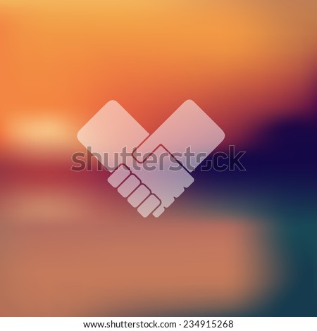handshake icon on blurred background