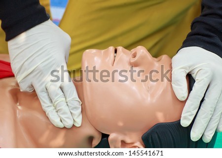 PHRAE,THAILAND - DECEMBER 20 : Unidentified  men are first aid training from staff  the hospital on  December 20, 2012 at local parks, Muang, Phrae, Thailand.