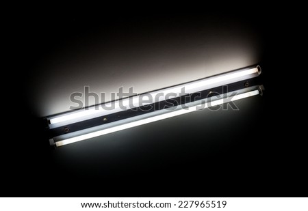 Detail of a fluorescent tube mounted on a wall