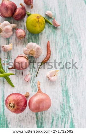 Fresh organic red onion on wooden background