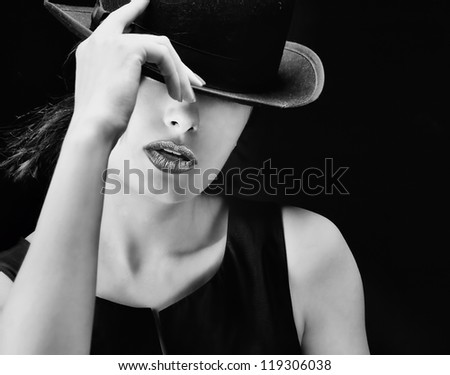 Sexy young pretty retro / vintage woman with a hat - picture in black and white