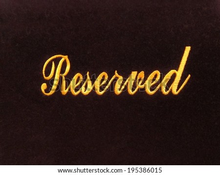 Reserved sign isolated on dark background / reservation concept in restaurant / church / hall / museum / doctor\'s office / movie theater