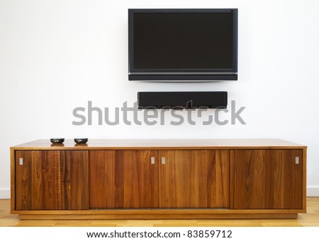 Wall mounted TV and cabinet underneath