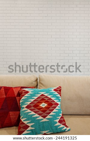 Interior architectural painted brick feature wall and sofa with space for text