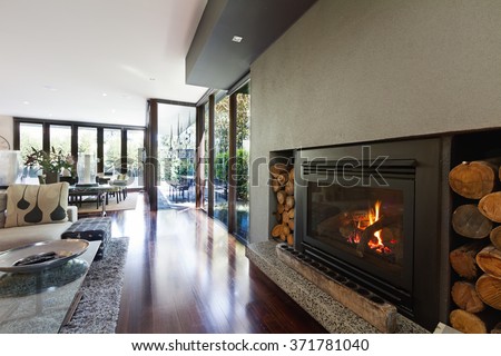 Cosy gas log fire in architect designed modern luxury open plan family home