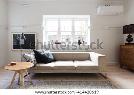 Beautifully Danish styled interior living room of sofa and coffee table in a renovated apartment