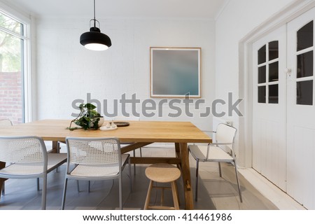 Modern scandinavian styled interior dining room with pendant light in Australia horizontal