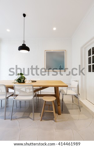 Modern scandinavian styled interior dining room with pendant light in Australia