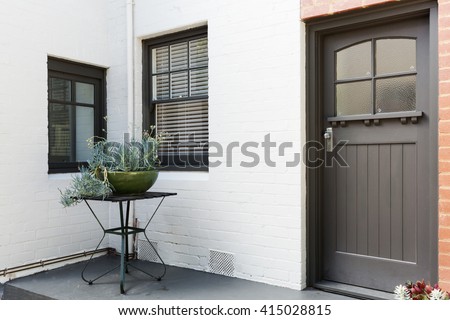 Entry porch and front door of an art decor style apartment in Australia