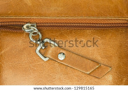 Camel colored leather texture with zipper background
