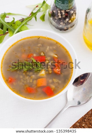 bowl of vegetable soup with brown bread