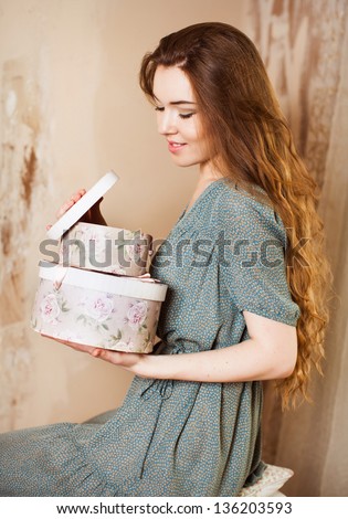 woman with gifts open box