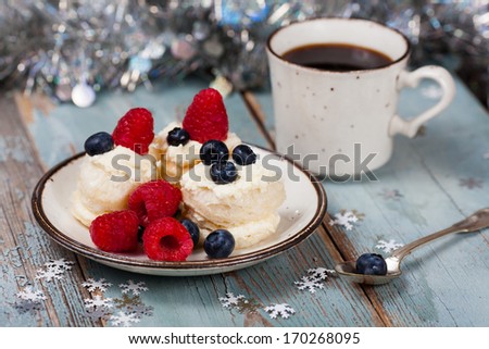 Coffee and Christmas dessert with fresh berries