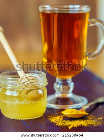 Cup of tea with honey and turmeric for  detox drink
