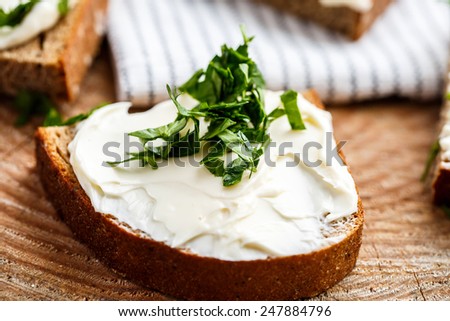 Sandwiches with melted cheese and herbs