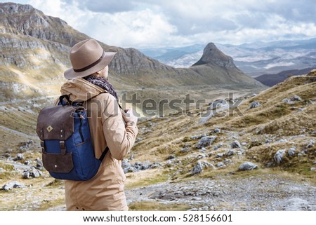 Young man in Hat starting an adventure in the mountain in Montenegro
