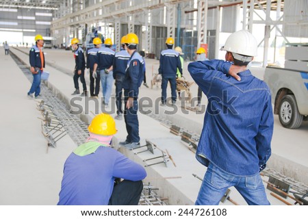 Working atmosphere in the construction, installation and safety of crane industrial.