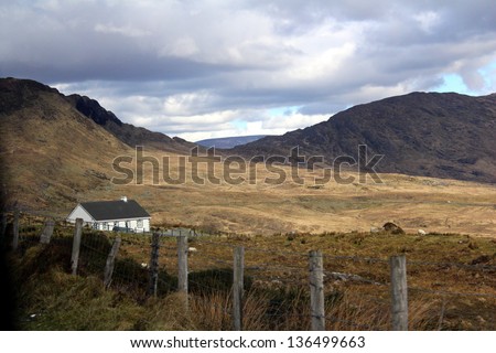 Mountain and pasture countryside in Ireland with house