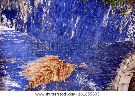 Abstract painted blue ceiling with exposed brick
