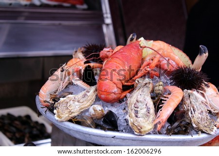 Plateful of lobster and other seafood dinner items