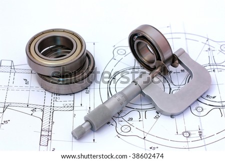 Micrometer measuring ball bearing on technical drawing