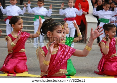 KOCAELI, TURKEY - APRIL 23: Unidentified children students dancing in Indian costumes for 23 April Children\'s Festival April 23, 2011 in Kocaeli, Turkey. April 23 was proclaimed a holiday in 1921