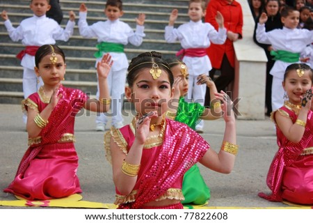 KOCAELI, TURKEY - APRIL 23: Unidentified children students dancing in Indian costumes for 23 April Children\'s Festival April 23, 2011 in Kocaeli, Turkey. April 23 was proclaimed a holiday in 1921