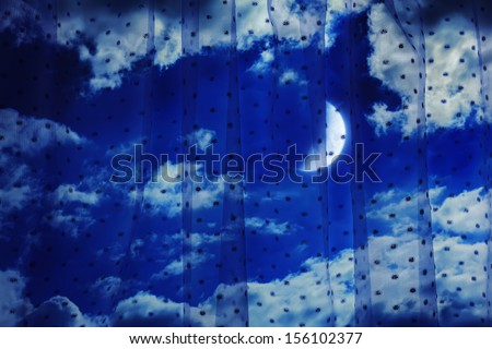 Night sky with the moon through the curtains