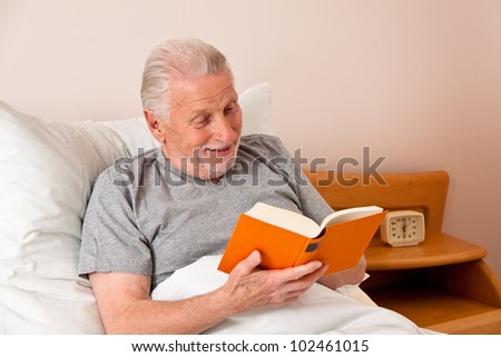 a senior in the nursing home to read the book in bed