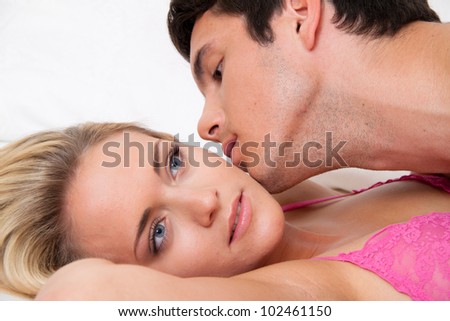 couple in bed during sex and affection. love and eroticism in the bedroom.