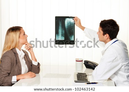 medical consultation. patient and doctor talking to a doctor\'s office
