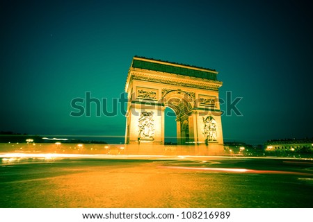 the arch of triumph (arc de triomphe) in paris, france. one of the landmarks of the city. at night.