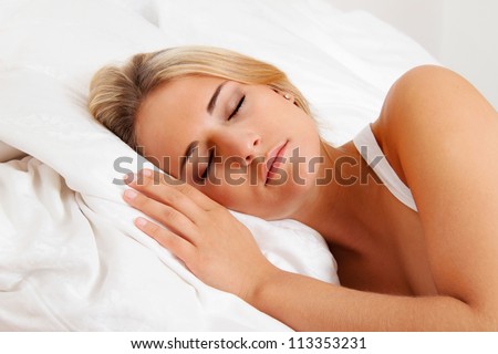 a young pretty woman sleeping in bed and recover.