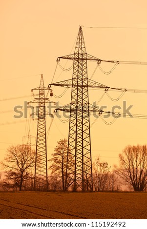 pylons of a high voltage power line. production and transport of energy.