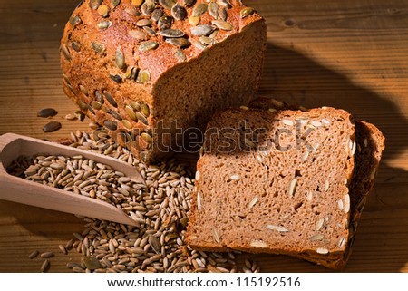a fresh bread with pumpkin seeds for a healthy diet. baked goods from black bread