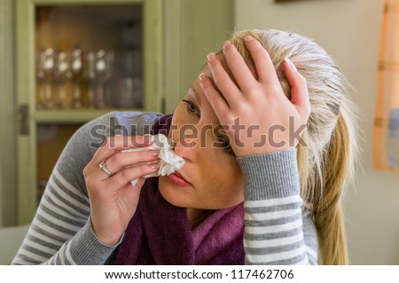 woman on sick leave with a handkerchief and drugs. cold, cold and flu season