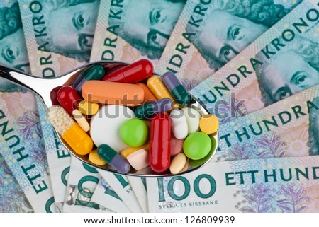 swedish krona, the currency of sweden. with tablets. health costs.