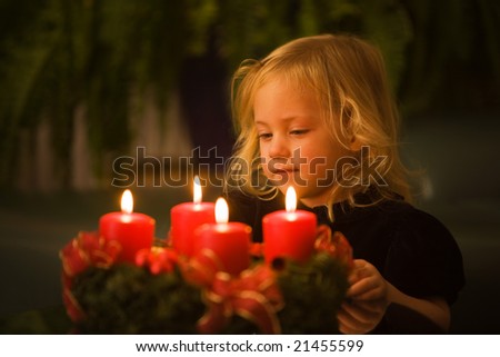 Child with Advent wreath at Christmas