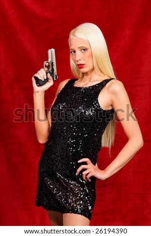 Little Lady in Black poses with gun drawn