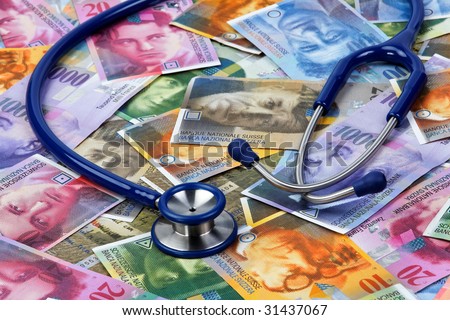 Swiss Franc and stethoscope as a symbol of health costs