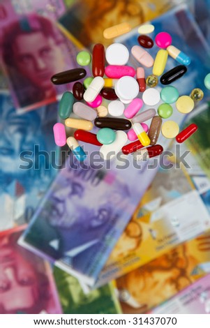 Swiss Franc and tablets as a symbol of health costs